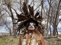 Phil Little Thunder from the Rosebud Reservation wears his ceremonial outfit in the tribal area on the grounds of the Fort Laramie National Historic Site in Fort Laramie, Wyoming, U.S., April 29, 2018. The tribal area was a large field organized into