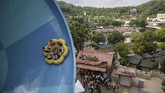 Orang-orang bermain di seluncur air di taman bermain Caribbean Bay di Yongin, di tepian kota Seoul. (AFP PHOTO / Ed JONES)