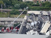 The collapsed Morandi Bridge is seen in the Italian port city of Genoa, Italy August 14, 2018.  REUTERS/Stefano Rellandini
