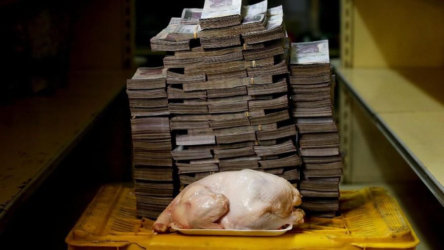 A 2.4 kg chicken is pictured next to 14,600,000 bolivars, its price and the equivalent of 2.22 USD, at a mini-market in Caracas, Venezuela August 16, 2018. It was the going price at an informal market in the low-income neighborhood of Catia. REUTERS/Carlos Garcia Rawlins SEARCH