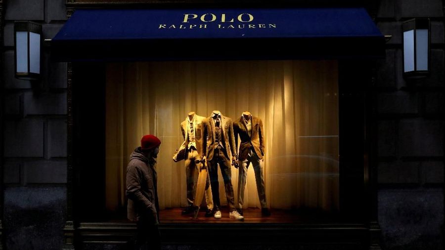 FILE PHOTO: A man walks past Ralph Lauren Corp.'s  flagship Polo store on Fifth Avenue in New York City, U.S., April 4, 2017.    REUTERS/Brendan McDermid/File Photo                         GLOBAL BUSINESS WEEK AHEAD