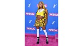 Asian Doll menjelma jadi Britney Spears Baby One More Time! Namun gaya ini tampaknya tak cocok dengan 'boneka Asia.' (AFP PHOTO / ANGELA WEISS)