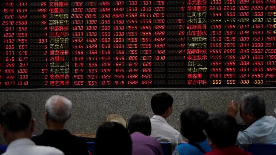 Investors look at computer screens showing stock information at a brokerage house in Shanghai, China September 7, 2018. REUTERS/Aly Song