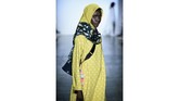 Kimberly Tandra menghadirkan desain busana couture dengan paduan futuristik dan kontemporer dengan sentuhan aneka warna dan alam Indonesia. (Fernanda Calfat/Getty Images for Indonesian Diversity/AFP)