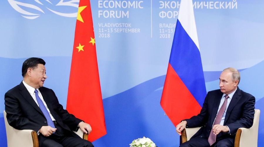 Chinese President Xi Jinping speaks with Russian President Vladimir Putin during their meeting on the sidelines of the Eastern Economic Forum in Vladivostok, Russia September 11, 2018. Mikhail Metzel/TASS Host Photo Agency/Pool via REUTERS