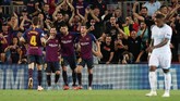 Lionel Messi menutup pesta gol itu dengan kemenangan 4-0 atas PSV sekaligus mencetak hattrick. Ini merupakan hattrick kedelapan La Pulga di Liga Champions sekaligus rekor baru dan mengalahkan jumlah trigol Cristiano Ronaldo. (REUTERS/Albert Gea)