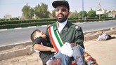 Sementara itu, Presiden Iran, Hassan Rouhani, sendiri menuding Amerika Serikat sebagai otak di balik serangan tersebut. (AFP Photo/ISNA/Behrad Ghasemi)