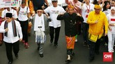 Pasangan Capres-Cawapres Jokowi dan Ma'ruf Amin mengikuti Pawai Deklarasi Pemilu Damai 2019-2024 di kawasan Monas dan Patung Kuda. Jakarta.Minggu. (23/9). (CNNIndonesia/Andry Novelino).