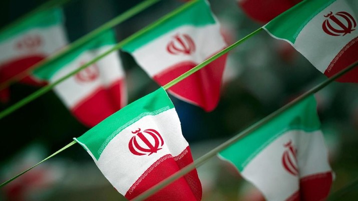 iran FILE PHOTO: Iran's national flags are seen on a square in Tehran February 10, 2012, a day before the anniversary of the Islamic Revolution. REUTERS/Morteza Nikoubazl/File Photo