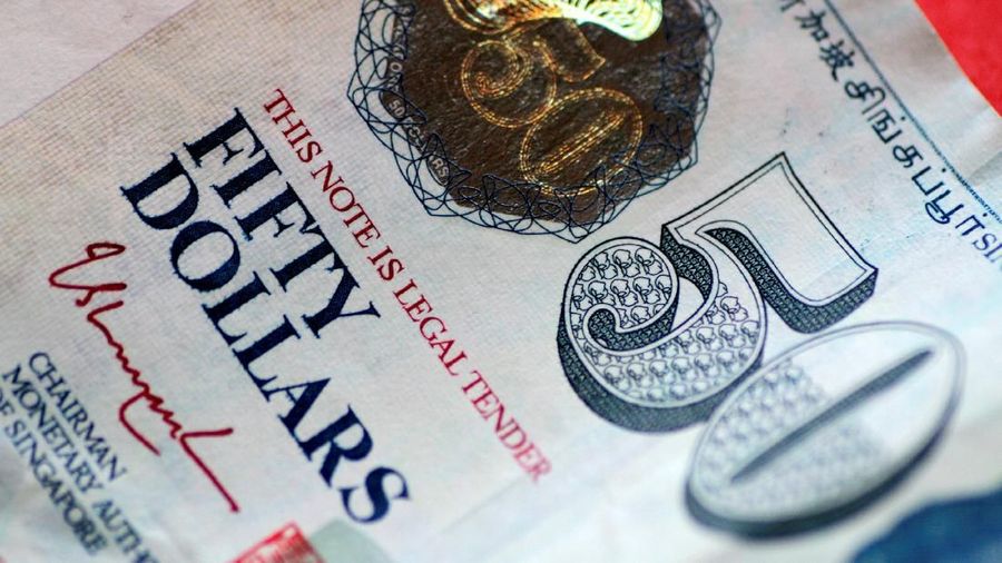 FILE PHOTO: A Singapore dollar note is seen in this illustration photo May 31, 2017.     REUTERS/Thomas White/Illustration/File Photo