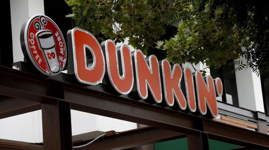 FILE PHOTO: The sign of a Dunkin' store, the first since a rebranding by the Dunkin' Donuts chain, is pictured ahead of its opening in Pasadena, California, U.S., August 2, 2017. REUTERS/Mario Anzuoni -/File Photo