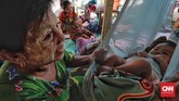 Warga Desa Wani 1 dan Wani Lumbu Petigo mengungsi di perbukitan Gunung Sigiba, Donggala, Sulawesi Tengah usai gempa dan tsunami pada pekan lalu. (CNN Indonesia/Adhi Wicaksono).