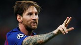 Selebrasi Lionel Messi merayakan gol ketiga Barcelona yang ia lesakkan ke gawang Tottenham Hotspur pada menit ke-56. (REUTERS/Eddie Keogh)