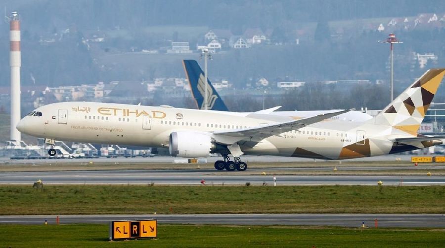 FILE PHOTO: An Etihad Boeing 787-9 Dreamliner aircraft takes off from Zurich Airport January 9, 2018. REUTERS/Arnd Wiegmann/File Photo