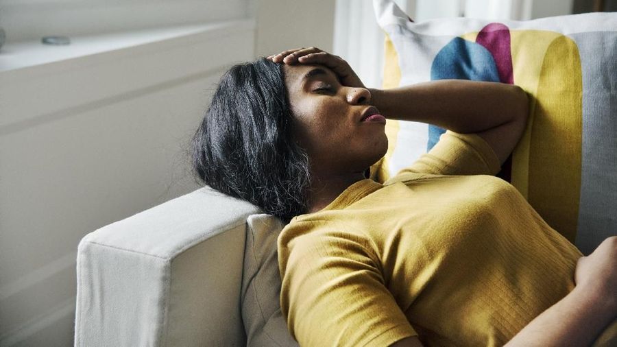 Black woman headache and sleeping
