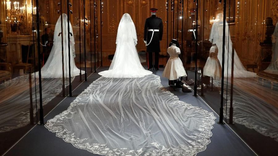 The wedding outfits of Meghan, Duchess of Sussex, and Harry, Duke of Sussex, are on display ahead of the exhibition A Royal Wedding, soon to open at Windsor Castle, in Windsor, Britain, October 25, 2018. REUTERS/Peter Nicholls
