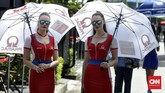 Gadis payung tim Pramac Racing. Duo pebalap tim tersebut, Jack Miller dan Danilo Petrucci finis berurutan di posisi ke-8 dan 9. (CNN Indonesia/Haryanto Tri Wibowo)