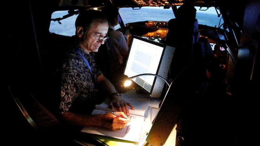 A senior instructor writes in a report book as he supervises the aviation students of Lion Air Group during a Jet Introduction session in Boeing 737-900ER simulator at Angkasa Training Center near Jakarta, Indonesia, November 2, 2018. Picture taken November 2, 2018. REUTERS/Willy Kurniawan To match Insight INDONESIA-CRASH/SAFETY