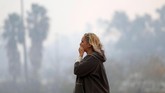 Begitu banyak korban dan kerusakan, bencana ini disebut-sebut sebagai kebakaran paling mematikan sepanjang sejarah AS. (Reuters/Eric Thayer)