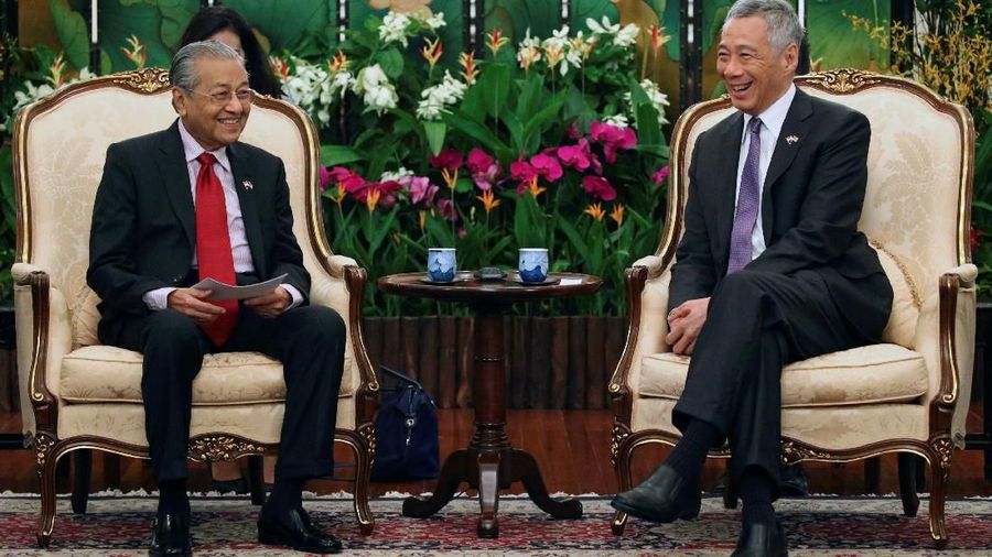 Singapura dan Mayasia kerja sama membendung penyebaran corona.