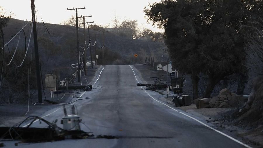 Downed power lines and debris are seen along Mulholland Highway in the aftermath of the Woolsey fire in Malibu, Southern California, U.S. November 11, 2018. REUTERS/Mario Anzuoni
