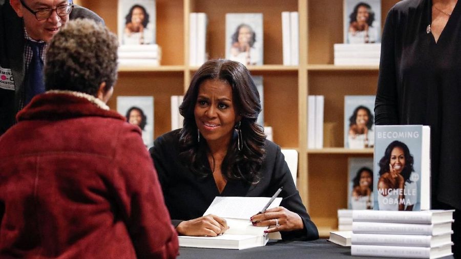 Former first lady Michelle Obama signs copies of her memoir