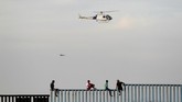 Sementara itu, ratusan anak imigran dilaporkan hilang, diduga diculik oleh kartel narkoba setempat. (Reuters/Jorge Duenes)