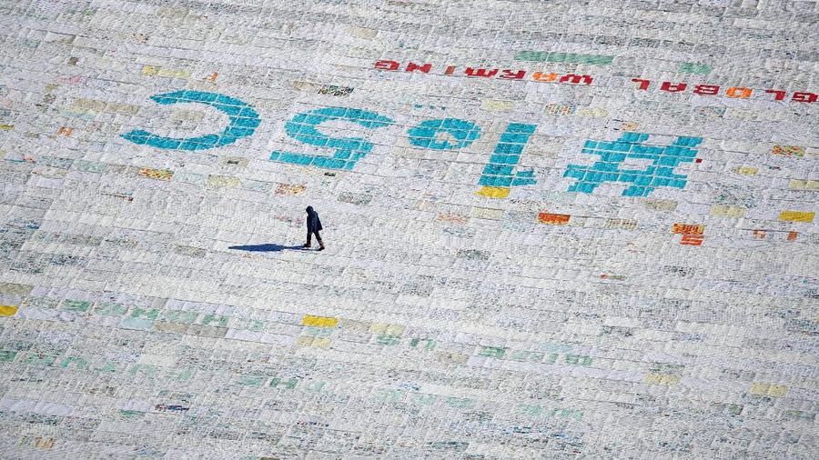 A general view shows 100,000 postcards with messages against climate change, sent by young people from all over the world and stuck together to break the Guinness World Record of the biggest postcard on the Jungfraufirn, the upper part of Europe's longest glacier, the Aletschgletscher, near Jungfraujoch, Switzerland November 16, 2018. REUTERS/Arnd Wiegmann