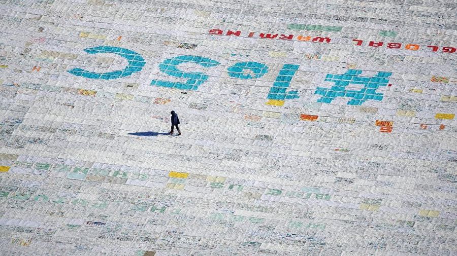 A general view shows 100,000 postcards with messages against climate change, sent by young people from all over the world and stuck together to break the Guinness World Record of the biggest postcard on the Jungfraufirn, the upper part of Europe's longest glacier, the Aletschgletscher, near Jungfraujoch, Switzerland November 16, 2018. REUTERS/Arnd Wiegmann
