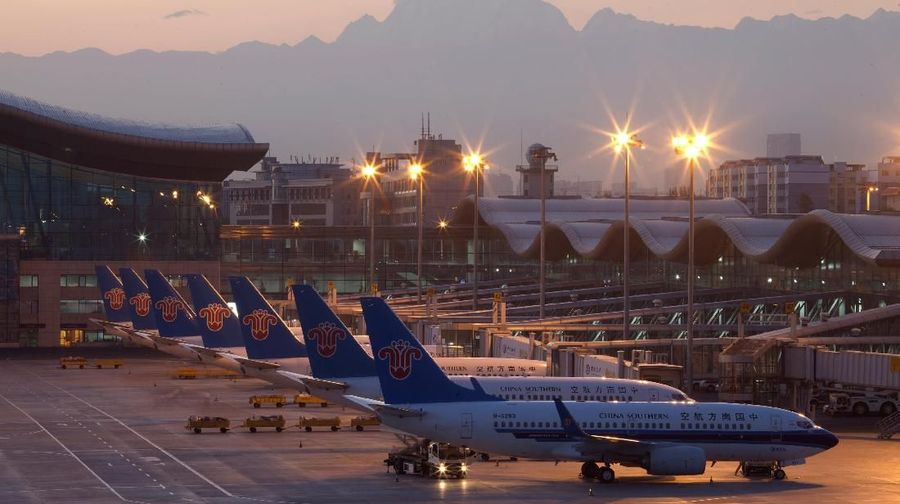 China Southern Airlines planes are seen at the Urumqi Diwopu International Airport, in Xinjiang Uighur Autonomous Region, China July 31, 2012. Picture taken with long exposure on July 31, 2012. REUTERS/Stringer ATTENTION EDITORS - THIS IMAGE WAS PROVIDED BY A THIRD PARTY. CHINA OUT.