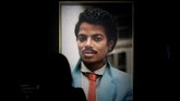 Artis Hank Willis Thomas menampilkan Michael Jackson sewaktu belum banyak terkena pisau bedah di meja operasi, dalam tajuk 'Time Can Be a Villain or a Friend'. Sepanjang kariernya, penampilan Jackson selalu dibicarakan publik. (REUTERS/Benoit Tessier)
