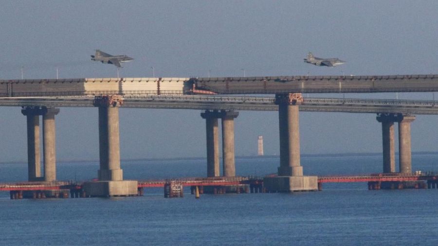 Russian jet fighters fly over a bridge connecting the Russian mainland with the Crimean Peninsula after three Ukrainian navy vessels were stopped by Russia from entering the Sea of Azov via the Kerch Strait in the Black Sea, Crimea November 25, 2018. REUTERS/Pavel Rebrov