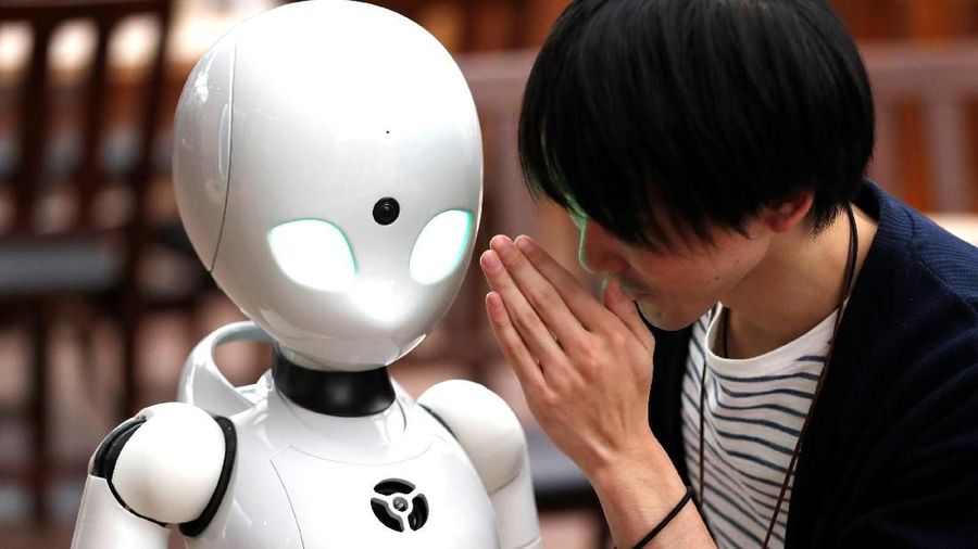 Remotely controlled robots OriHime-D, developed by Ory Lab Inc. to promote employment of disabled people, serve customers at a cafe in Tokyo, Japan November 26, 2018.  REUTERS/Issei Kato