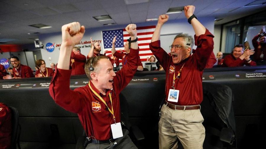 NASA engineers Kris Bruvold (L) and Sandy Krasner react in the space flight operation facility at NASA's Jet Propulsion Laboratory (JPL) as the spaceship InSight lands on the surface of Mars after a six-month journey, at JPL in Pasadena, California, U.S. November 26, 2018. Al Seib/Pool via REUTERS TPX IMAGES OF THE DAY