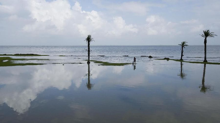 A boy catches fish during high tide on Ghoramara Island, India, September 8, 2018. Ghoramara Island, part of the Sundarbans delta on the Bay of Bengal, has nearly halved in size over the past two decades, according to village elders. REUTERS/Rupak De Chowdhuri SEARCH