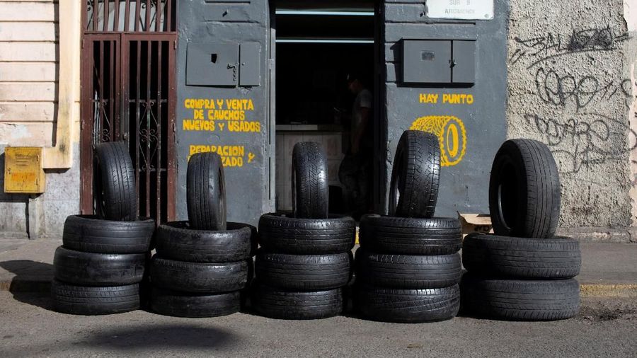 Worn-out tires for sale are seen in a workshop in Caracas, Venezuela December 10, 2018. REUTERS/Manaure Quintero