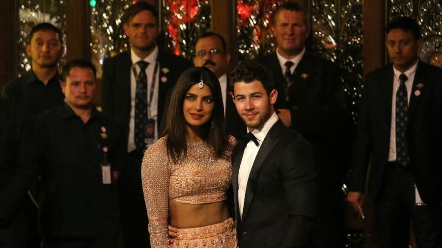 Actress Priyanka Chopra and her husband Nick Jonas arrive to attend the wedding ceremony of Isha Ambani, the daughter of the Chairman of Reliance Industries Mukesh Ambani, in Mumbai, India, December 12, 2018. REUTERS/Francis Mascarenhas