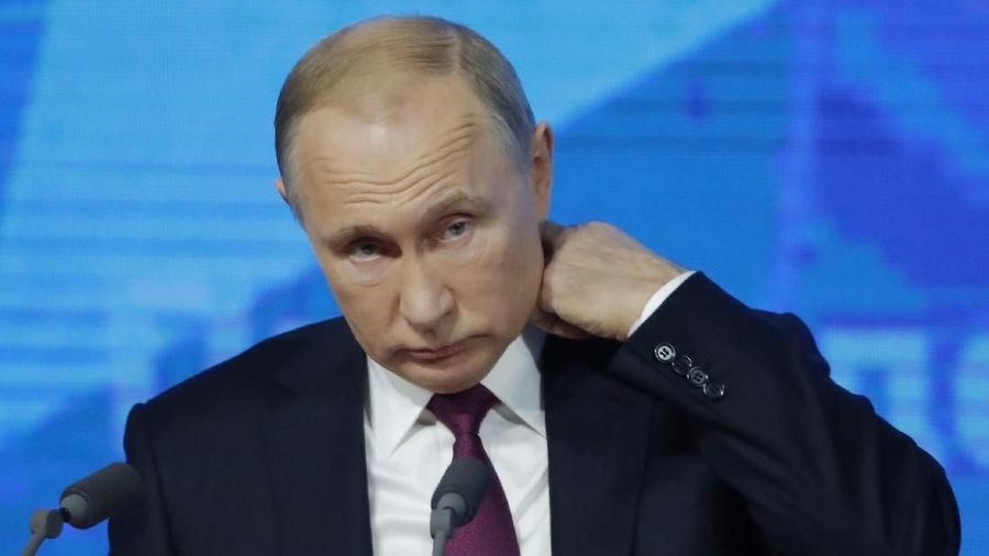 Russian President Vladimir Putin listens during annual news conference in Moscow, Russia December 20, 2018.