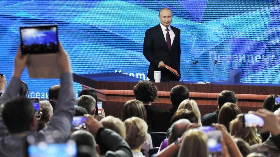 Russian President Vladimir Putin listens during annual news conference in Moscow, Russia December 20, 2018.