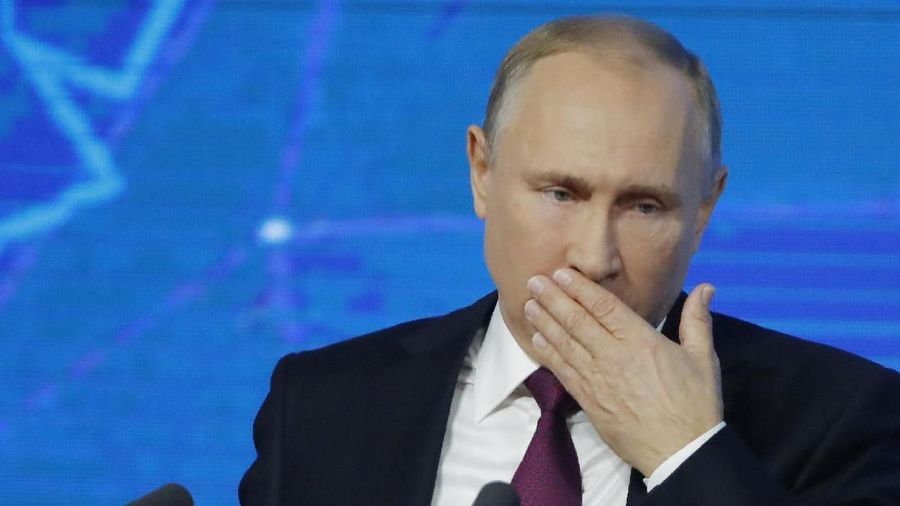 Russian President Vladimir Putin listens during annual news conference in Moscow, Russia December 20, 2018.