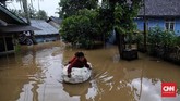 Kampung Kadugareng atau Sukarame atau Karanganyar Rt 04/03, Pandeglang terendam air luapan sungai Cipunten Agung yang langsung mengalir ke laut. (CNN Indonesia/Hesti Rika).