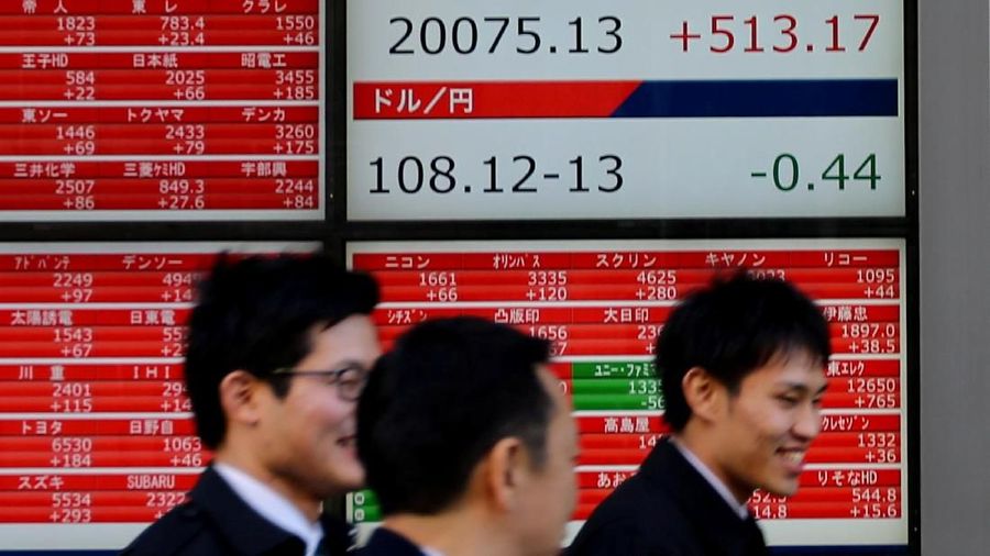 A man is reflected on an electronic board showing a graph analyzing recent change of Nikkei stock index outside a brokerage in Tokyo, Japan, January 7, 2019. REUTERS/Kim Kyung-Hoon