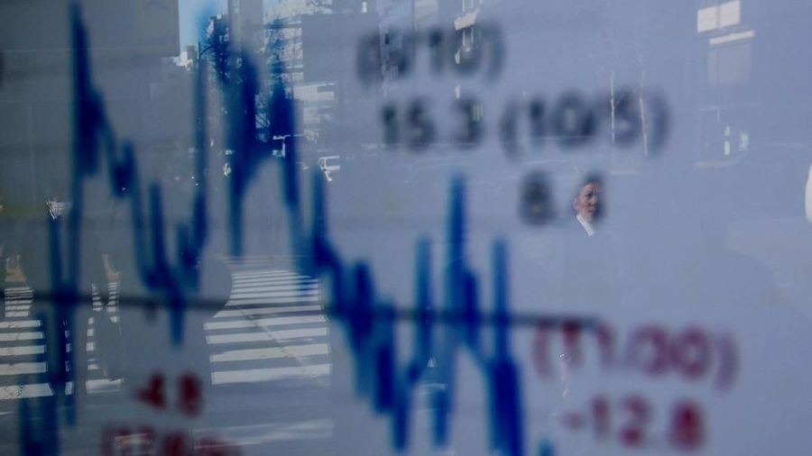 A man is reflected on an electronic board showing a graph analyzing recent change of Nikkei stock index outside a brokerage in Tokyo, Japan, January 7, 2019. REUTERS/Kim Kyung-Hoon