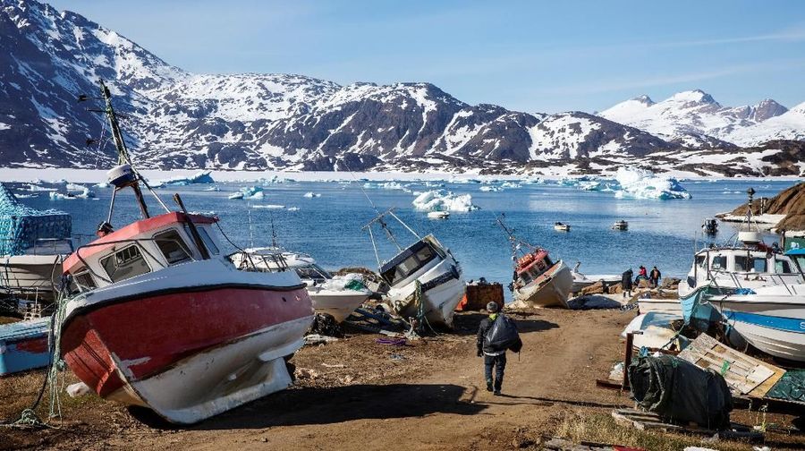 Seal hunter Henrik Josvasson jumps back onto his boat after searching for puffin eggs near the town of Tasiilaq, Greenland, June 16, 2018. REUTERS/Lucas Jackson SEARCH