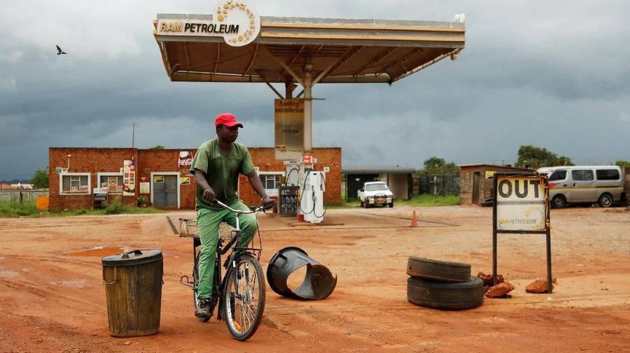 A man cycles past a petrol station closed after protests in Harare, Zimbabwe, January 15, 2019. REUTERS/Philimon Bulawayo