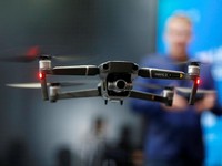 A DJI Mavic 2 Zoom flies in a netted area during the 2019 CES in Las Vegas, Nevada, U.S. January 9, 2019. REUTERS/Steve Marcus