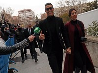 Portugal's soccer player Cristiano Ronaldo arrives with his girlfriend Georgina Rodriguez to appear in court on a trial for tax fraud in Madrid, Spain, January 22, 2019. REUTERS/Susana Vera