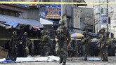 Filipina bersumpah akan memburu dalang di balik serangan bom di salah satu gereja yang menewaskan 20 orang pada Minggu (27/1). (AFP Photo/Nickee Butlangan)