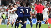 Sempat ada pertikaian antara Karim Ansarifard dengan Gaku Shibasaki and Sei Muroya dari Jepang. (REUTERS/Suhaib Salem)