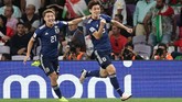 Setelah tanpa gol di babak pertama, Yuya Osako mampu memecah kebuntuan di menit ke-56. Sebelas menit kemudian, Osako menggandakan keunggulan lewat tendangan penalti. (REUTERS/Suhaib Salem)